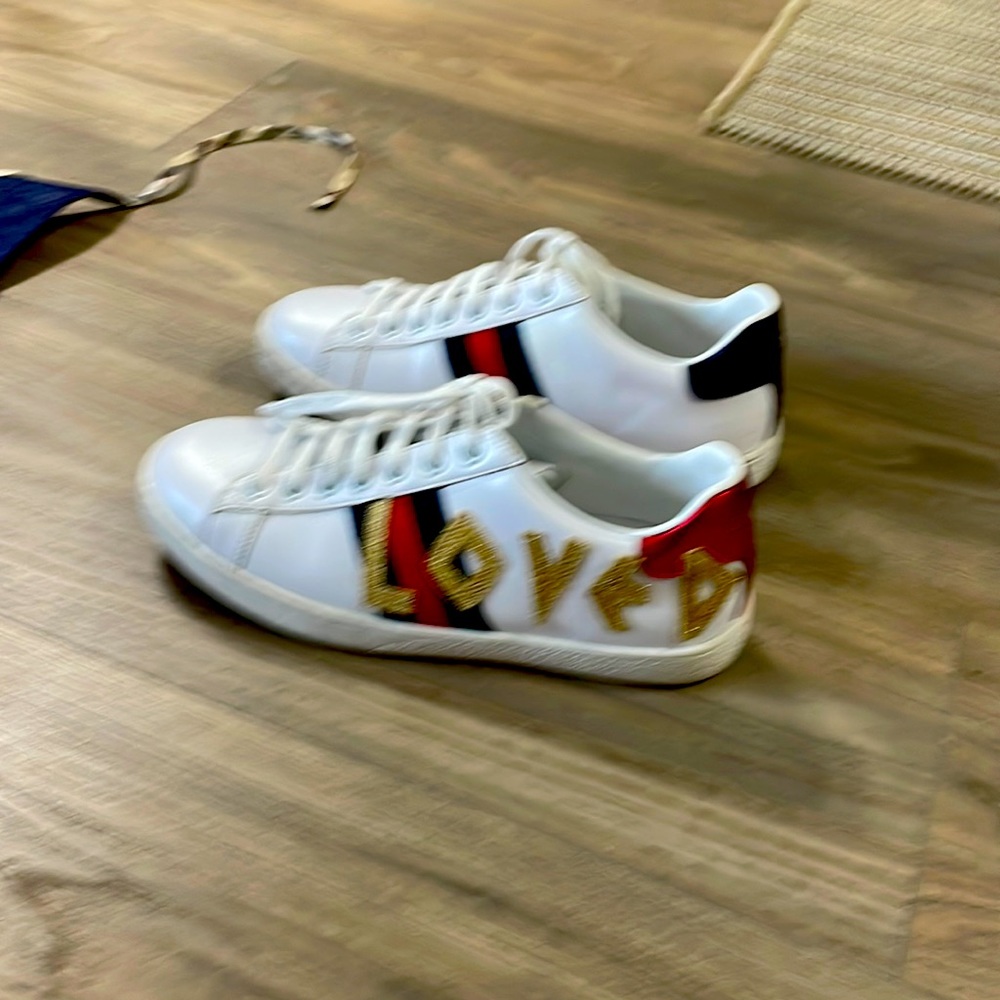 Authentic Gucci ace sneakers with Loved written on the side of them. Size (38)